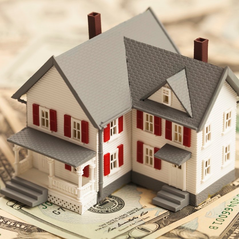 Single family house on pile of money