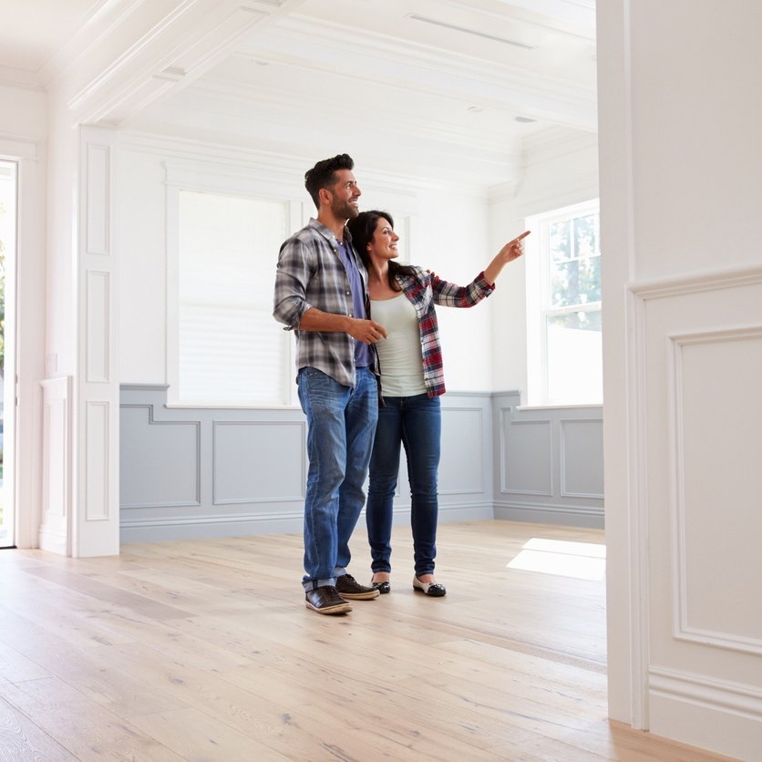 Hispanic Couple Viewing Potential New Home